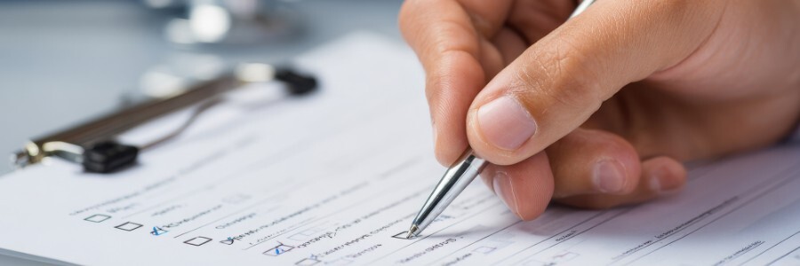 img blog Doctor Filling Out Medical Form